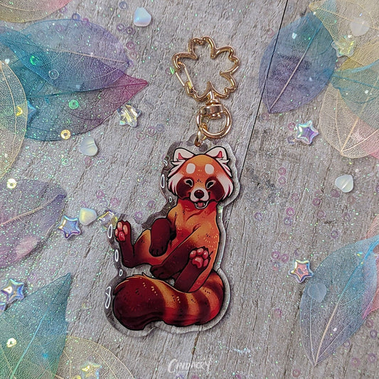 Llavero acrílico con dije de panda rojo y sakura